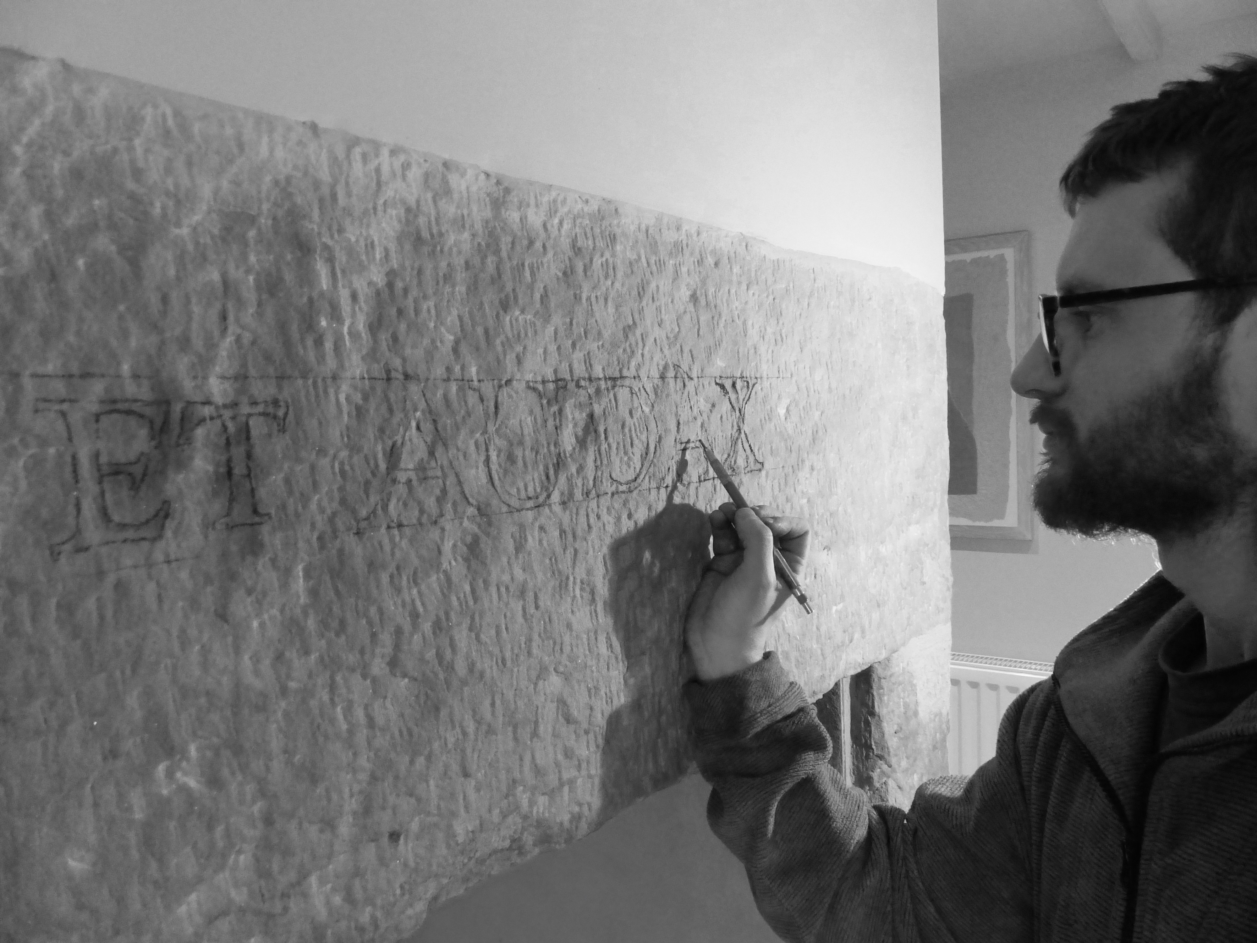 drawing out of inscription onto fireplace